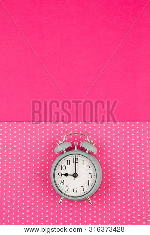 Flat Lay With Vintage Alarm Clock Over The Bastel Background