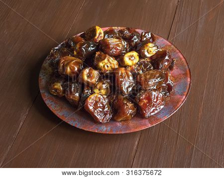 Delicious Organic Sweet Dates In Bowl With Syrup. Iftar Dates.