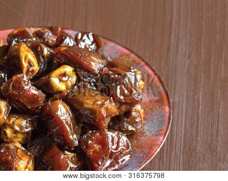 Delicious Organic Sweet Dates In Bowl With Syrup. Iftar Dates.