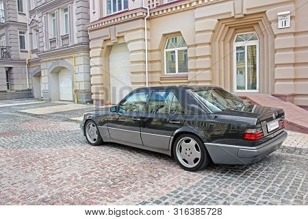 Kiev, Ukraine - September 6, 2013: Mercedes E500 W124 Wolf On The Background Of Beautiful Old Houses