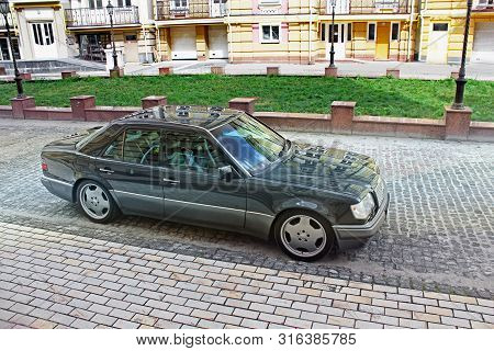 Kiev, Ukraine - September 6, 2013: Mercedes E500 W124 Wolf On The Background Of Beautiful Old Houses