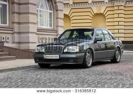 Kiev, Ukraine - September 6, 2013: Mercedes E500 W124 Wolf On The Background Of Beautiful Old Houses