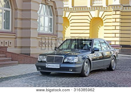 Kiev, Ukraine - September 6, 2013: Mercedes E500 W124 Wolf On The Background Of Beautiful Old Houses