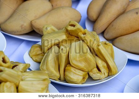Fresh Jackfruit Slices On A White Plate. Sweet Yellow Jackfruit Ripe. Vegetarian, Vegan, Raw Food. E