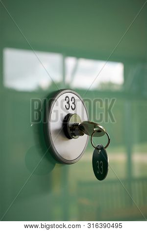 Key On A Deposit Box With The Number 33