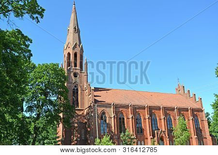Fragment Of Lutheran Church Of Haynrikhsvalde (1869) Against The Background Of The Sky. Slavsk, Kali