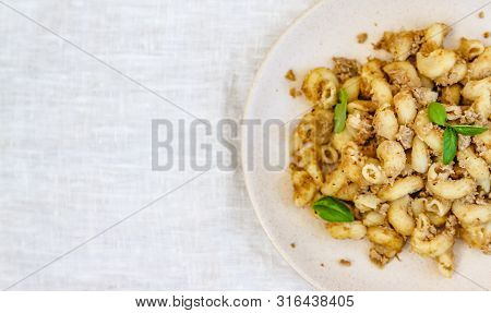 Traditional Soviet Russian Pasta Dish, Vermicelli, Navy Pasta, With Meat On A White Plate On A Light