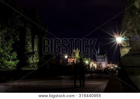 Beautiful Charles Bridge (karluv Most) With Old Town Tower (staromestska Mostecka Vez) At Night. Pra
