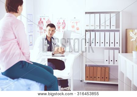The Patient And His Doctor In Medical Office