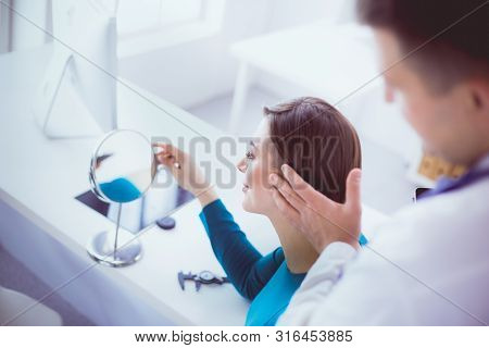 The Patient And His Doctor In Medical Office