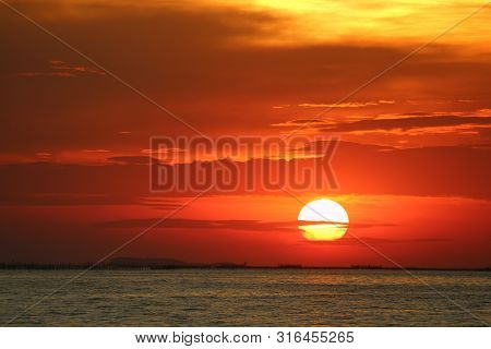 Sunset On Red Yellow Sky Back Soft Evening Cloud Over Horizon Sea