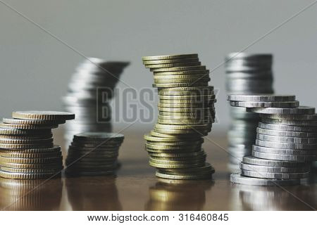 Stack The Coins Into Steps. Business Growth Concept