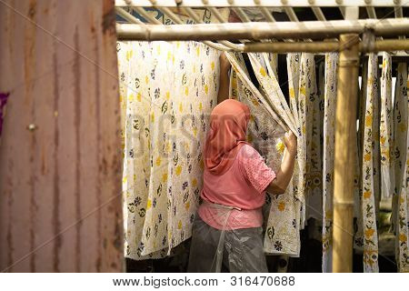 August 11 2019, Surakarta Indonesia : Close Up Hand To Make Batik On The Fabric With Canting With Bo