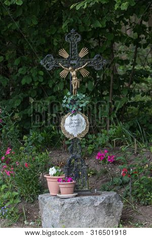 A Cross Or Cruzifix Nest To A Little Pathway In Bavaria