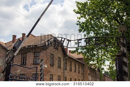 Auschwitz-birkenau, Poland - June 27, 2019 The Inscription ,, Arbeit Macht Frei ,, Of The German Con