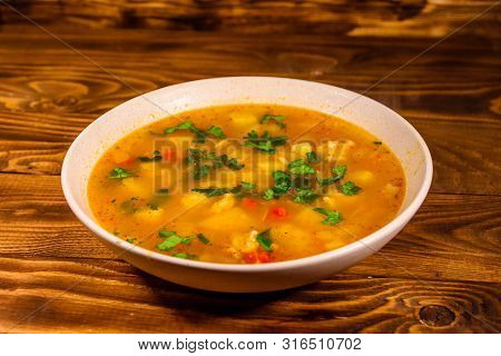 Georgian Traditional Food Soup Kharcho On Rustic Wooden Table