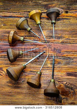 Different Gravers For Jewelry On A Wooden Background