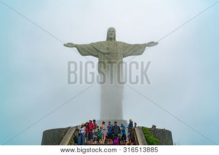 Rio De Janeiro, Brazil - March 2, 1916 : Tourists Taking Picture In Front Of The Iconic Christ The R