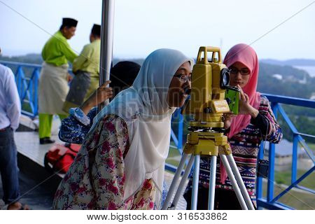 Labuan, Malaysia - Jun 27, 2014 : Muslim Looking Through The Theodolite To Observe Moon To Mark The 