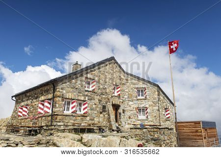 Tierberglihut In The Swiss Alps With A Cloud
