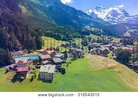 Aerial View Of The Village Of Lauterbrunnen From The Mountain Mannlichen. Switzerland.