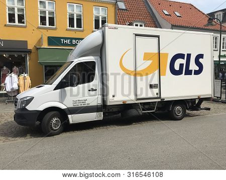Roskilde, Denmark - July 19, 2019: White Gls Delivery Truck Parked By The Side Of The Road. Nobody I