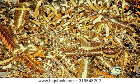 Copper And Brass Metal Shavings, Metal Sawdust Close-up. Abstract Color Background.