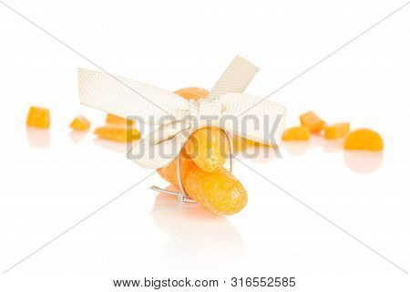 Group Of Two Whole Lot Of Pieces Of Stale  Orange Stale Baby Carrot Baby With Bow Isolated On White 