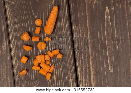One Whole Lot Of Pieces Of Stale  Orange Stale Baby Carrot Baby In A Wooden Bowl Flatlay Isolated On