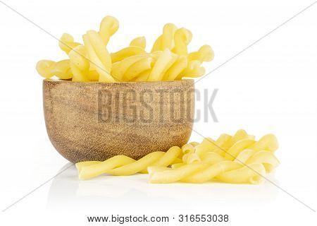 Lot Of Whole Twisted Raw Pasta Gemelli In Wooden Bowl Isolated On White Background