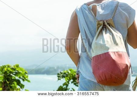 Woman, Back Pack And Cliff.