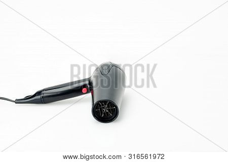 Electrical Hair Dryer For Household On The White Mat Background With Copy Space