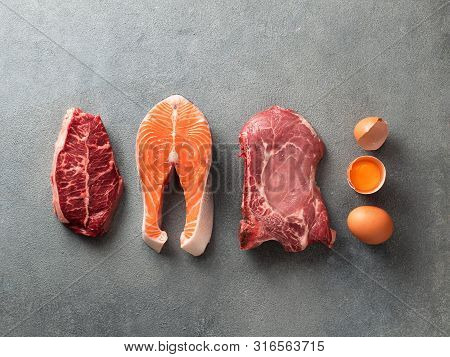 Carnivore Or Keto Diet Concept. Raw Ingredients For Zero Carb Or Low Carb Diet - Rib Eye, Salmon Ste