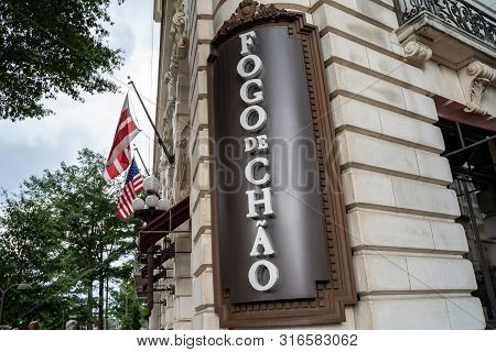Washington, Dc - August 7, 2019: A Store Front Sign For An Upscale Brazilian Steak House - Fogo De C