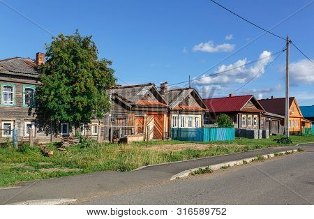 Russian Village In Summer, View Of The Village Street With Old And New Traditional Wooden Houses. Vi