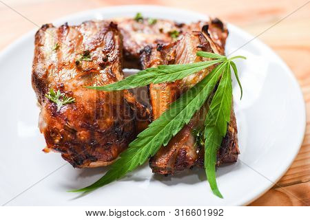Cannabis Food With Bbq Pork Ribs Grilled With Herbs Spices Served On White Plate / Roasted Barbecue 