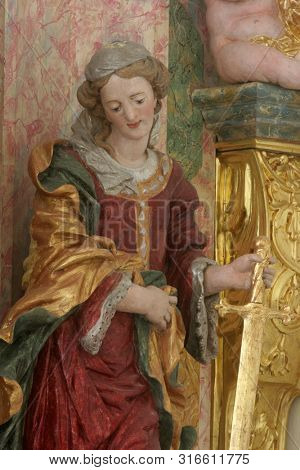 SAMOBOR, CROATIA - MARCH 03, 2018: Saint Catherine of Alexandria, statue on the altar of the Holy Three Kings in the Church of the Assumption of the Virgin Mary in Samobor, Croatia