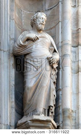 MILAN, ITALY - JUNE 22, 2018: Saint Judas Thaddaeus, statue on the Milan Cathedral, Duomo di Santa Maria Nascente, Milan, Lombardy, Italy