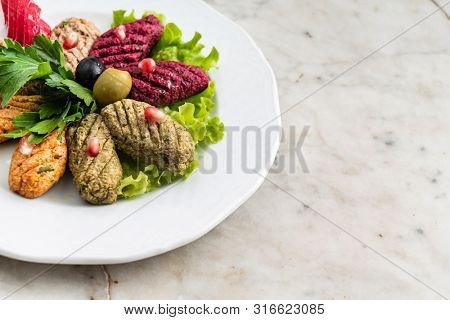 Phali - a traditional Georgian snack with vegetables and nuts top view