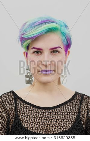 Young Beautiful Woman With Dyed Blue And Green Hair. Pixie Bob Short Haircut The Concept Of Hair Sty