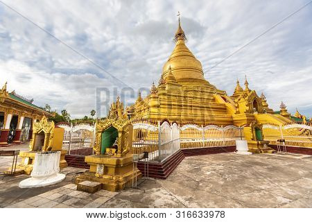 Mandalay, Aungmyaythazan / Myanmar, Burma - July 24, 2019: Kuthodaw Pagoda, Golden Yellow Buddhist R