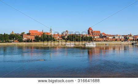 Panoramic View Of Torun City And Wisla (vistula) River In Sunny Day. Poland, Summer 2019