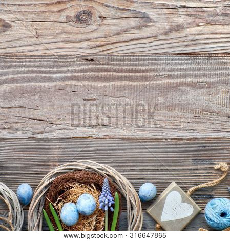 Easter Background With Blue Hyacinth Flowers, Easter Eggs, Wooden Heart And Decorations On Rustic Wo