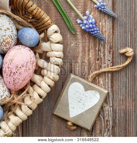 Easter Background With Eggs, Blue Hyacinth Flowers And  Wooden Heart, Top View On Rustic Wood, Squar
