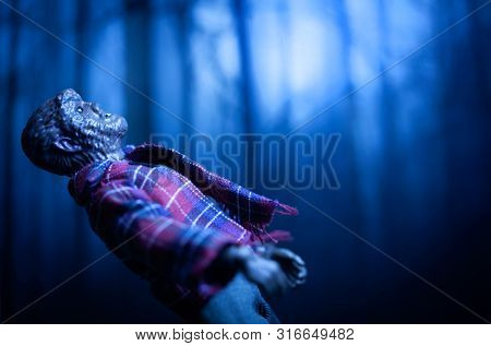 AUG 9 2019: Horror movie werewolf lurking in the forest at night howling at the full moon - Mego action figure