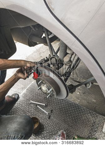 Change Brake Pads. Machanic Change Break Pads On Car.