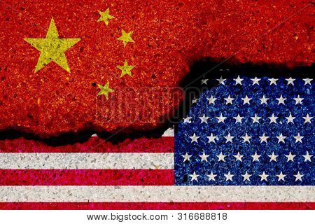 Crack Of Usa And China Flag .iit Is Symbol Of Economic Tariffs Trade War And Tax Barrier Between Uni