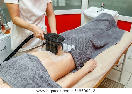Cryolipolysis Fat Freezing Treatment. Weight Loss And Slimming Procedure In Beauty Salon