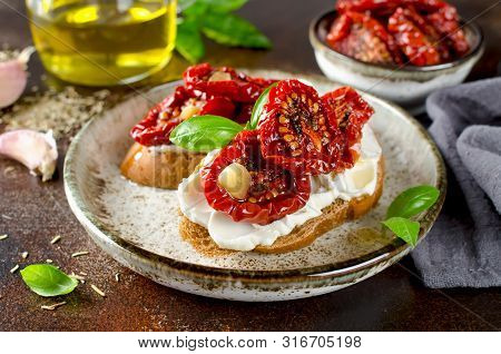 Bruschetta With Olive Oil, Sundried Tomatoes, Cottage Cheese And Fresh Basil. Tasty Savory Italian A
