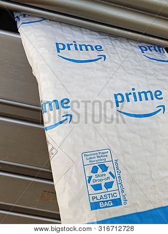 Tel-aviv, August 2019: Amazon Prime Mail Envelope For Small Shopping Delivered And Showing Out Of Ma